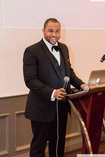 Wayde speaking at a formal event